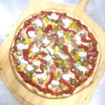 Victory Pizza's Pork Roll, Sausage, cherry, jalapeño & banana peppers with dollops creamy ricotta cheese.